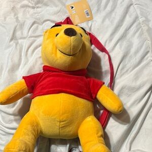 Disney Winnie the Pooh plush character backpack.